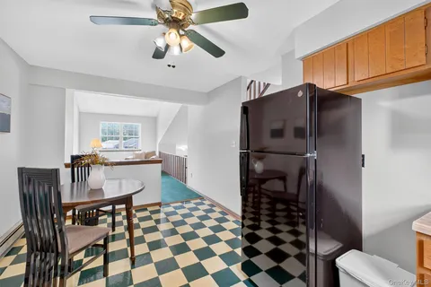 a kitchen with stainless steel appliances a stove a sink and cabinets
