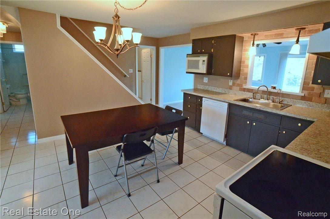 5520 Pine Knob Road Clarkston, MI 48346 - Photo 2 of 24 Roomy kitchen with ceramic tile flooring