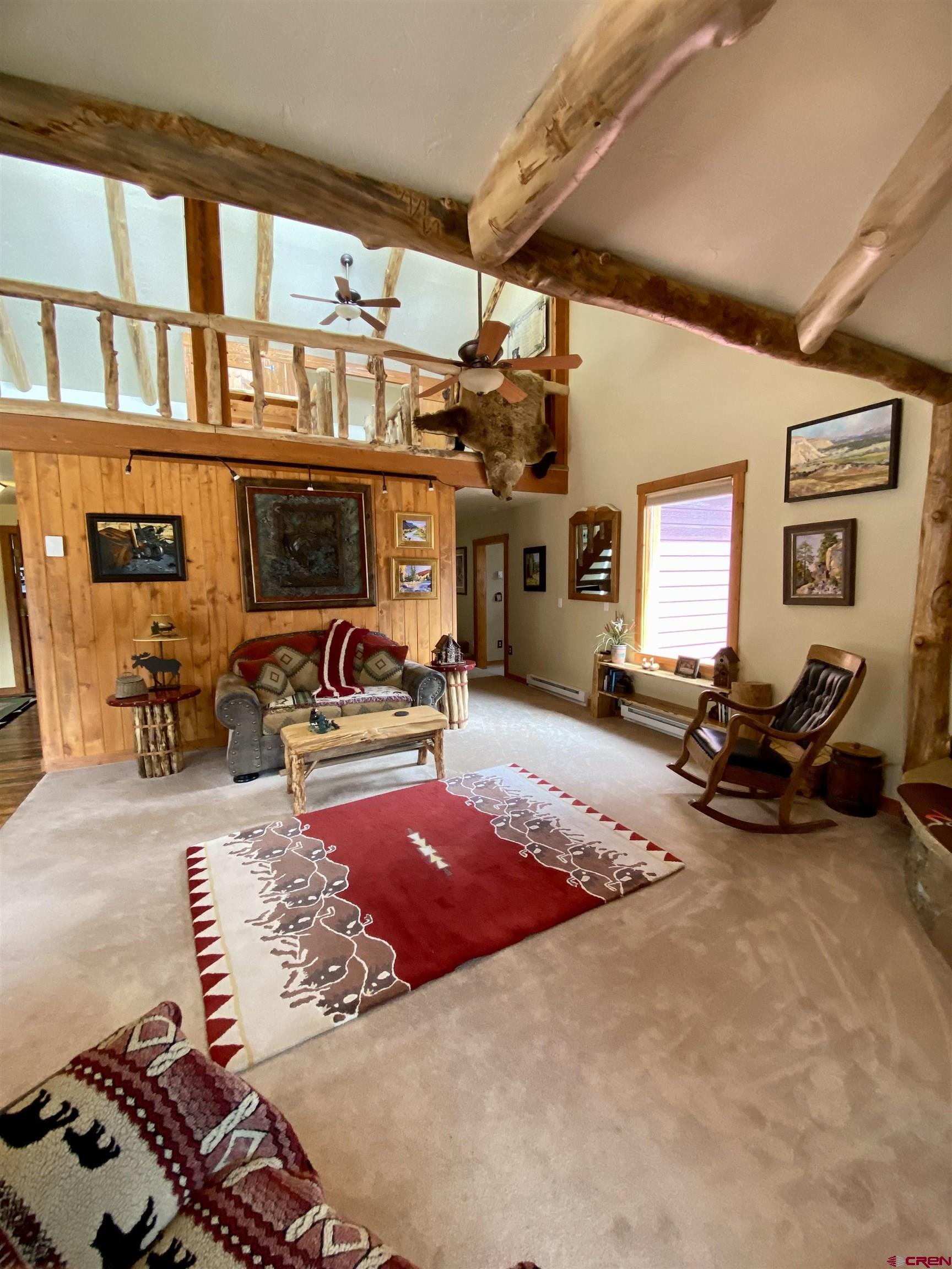 480 Bear Trail Montrose, CO 81403 - Photo 16 of 35 a bed room with furniture and a flat screen tv