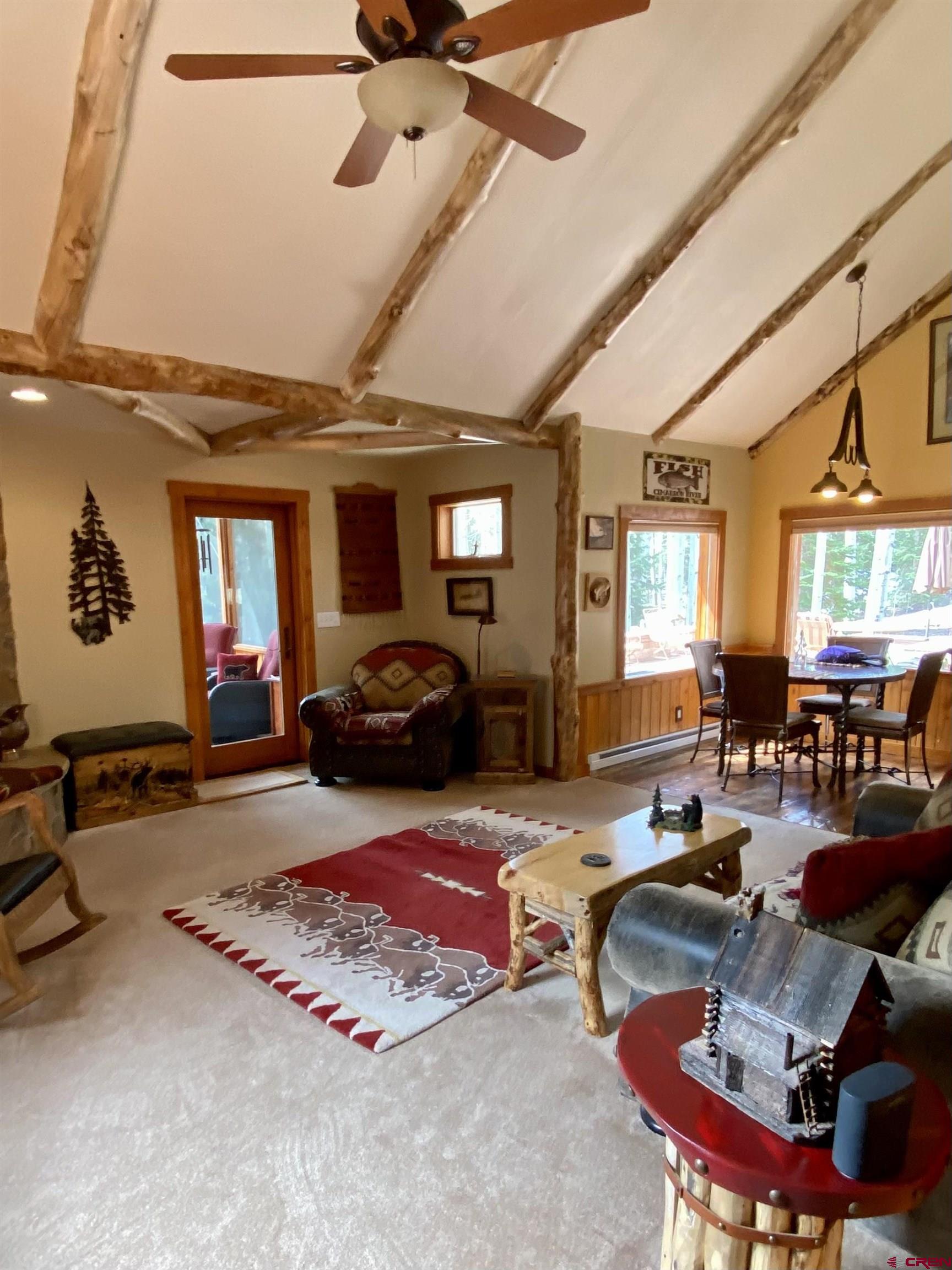 480 Bear Trail Montrose, CO 81403 - Photo 19 of 35 a living room with furniture gym equipment and a large window