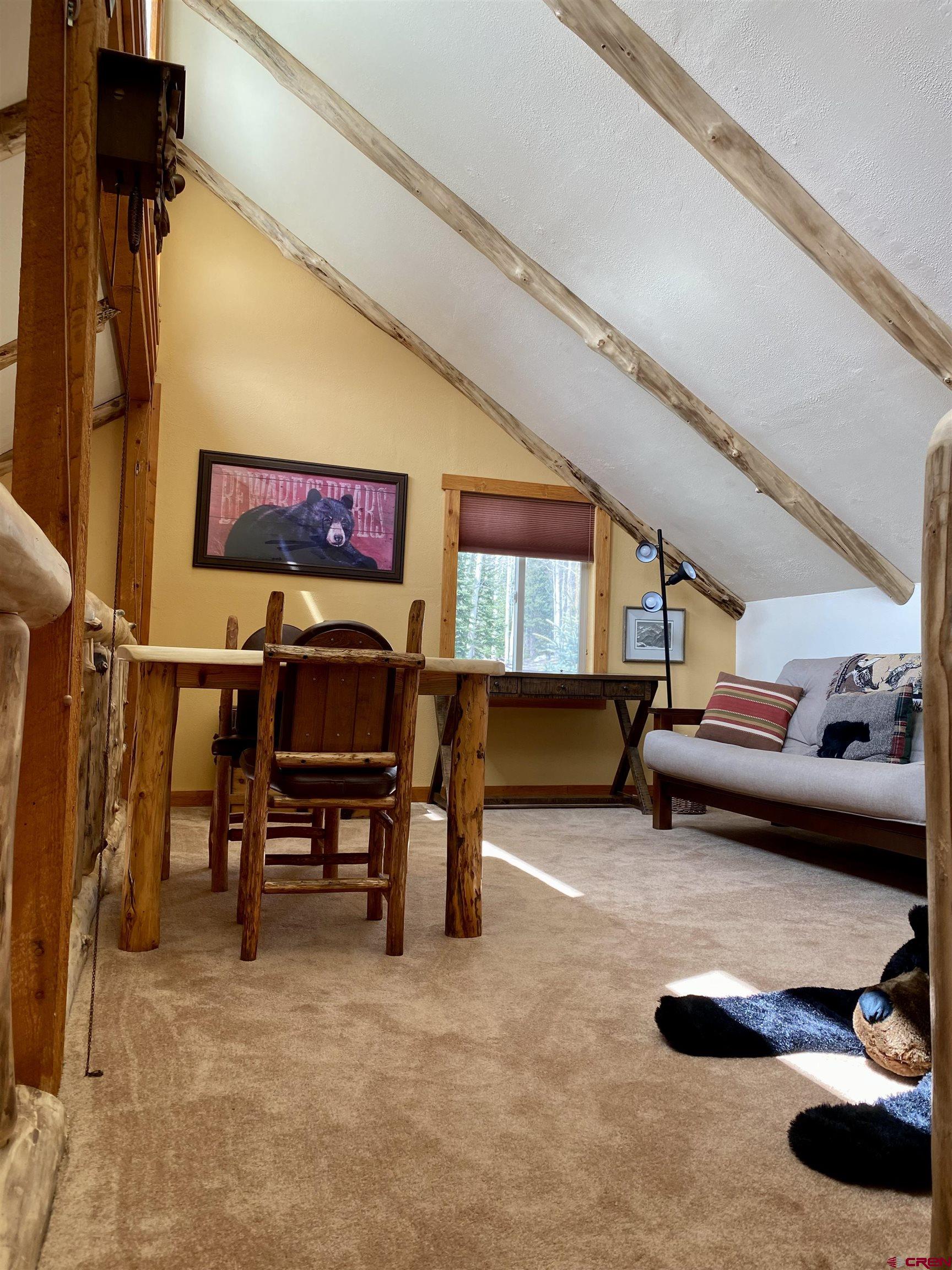 480 Bear Trail Montrose, CO 81403 - Photo 20 of 35 a bedroom with furniture and a chair