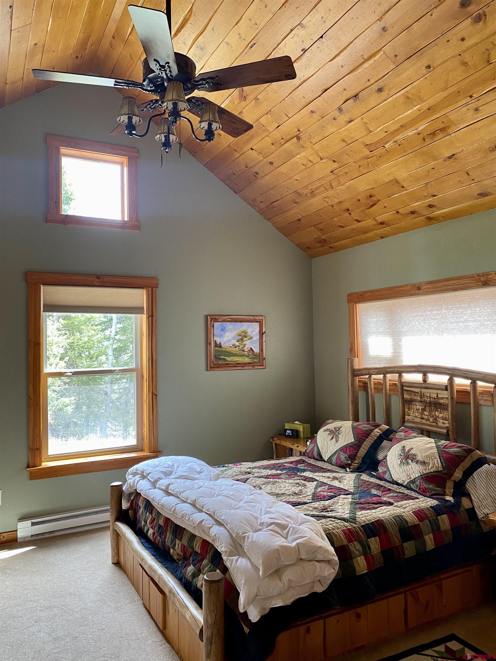 480 Bear Trail Montrose, CO 81403 - Photo 26 of 35 a bed sitting in a bedroom next to a window