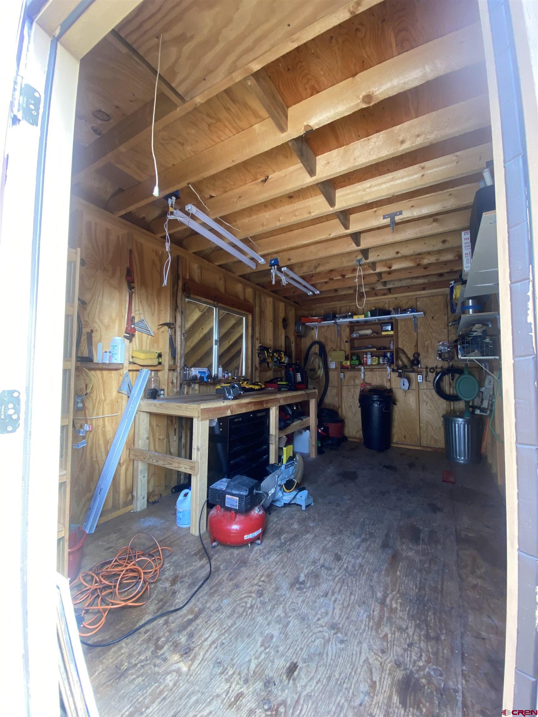 480 Bear Trail Montrose, CO 81403 - Photo 32 of 35 a view of a storage room with racks