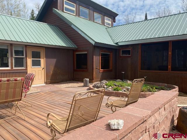 480 Bear Trail Montrose, CO 81403 - Photo 4 of 35 a view of a house with backyard and sitting area