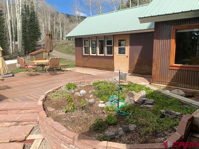 480 Bear Trail Montrose, CO 81403 - Photo 5 of 35 a backyard of a house with yard and outdoor seating