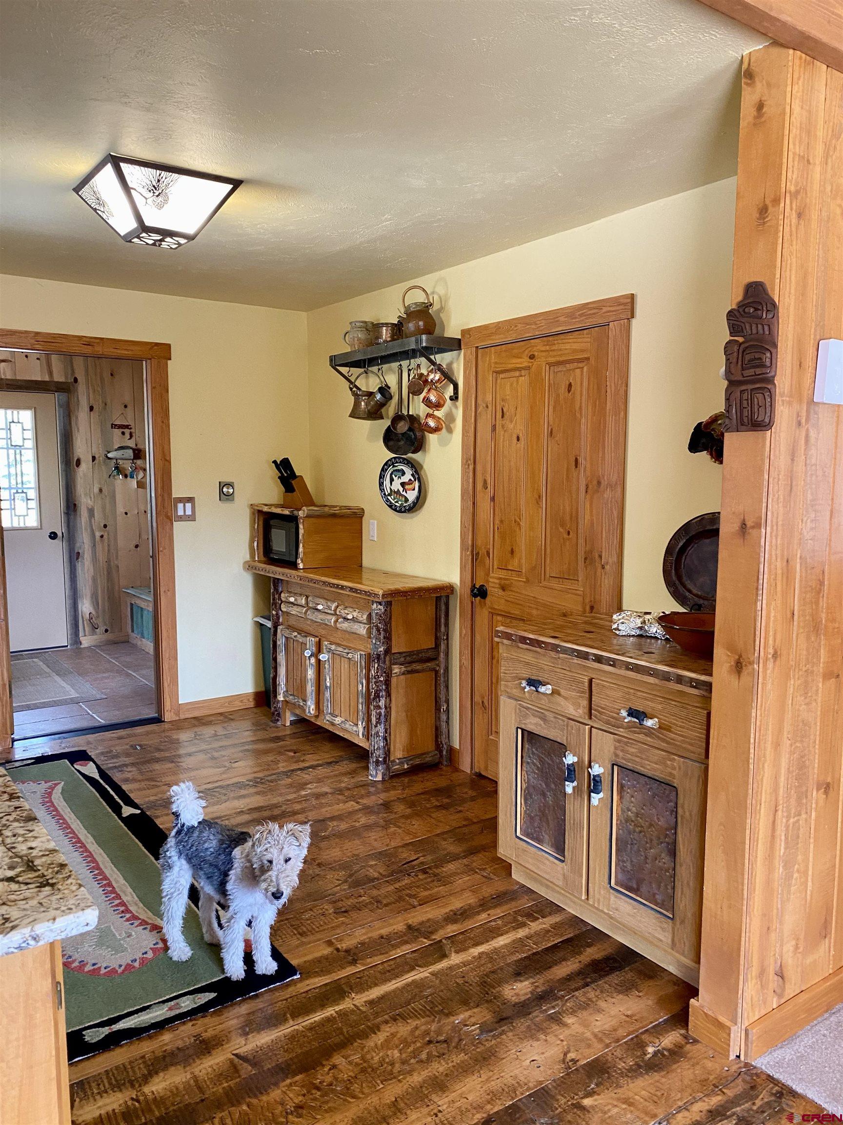 480 Bear Trail Montrose, CO 81403 - Photo 9 of 35 a kitchen with stainless steel appliances granite countertop a stove and a microwave