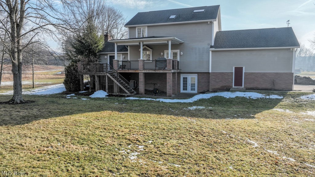 4848 Fette Road Dennison, OH 44621 - Photo 4 of 48 Rear view of property with brick siding, a wooden deck, a lawn, and a patio