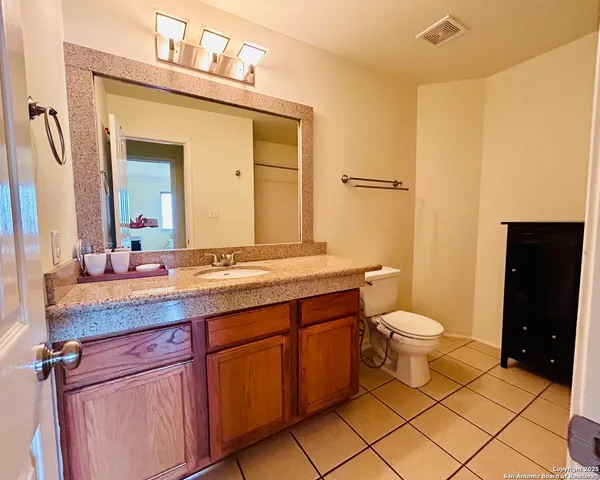 a view of a backyard with sitting area