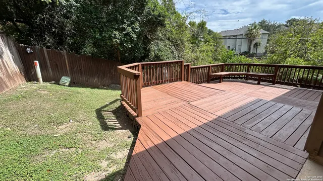 a balcony with wooden floor