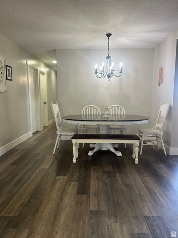 558 North N Cres Road Roosevelt, UT 84066 - Photo 19 of 31 Open dining area featuring rich wood-finish flooring and a black iron chandelier