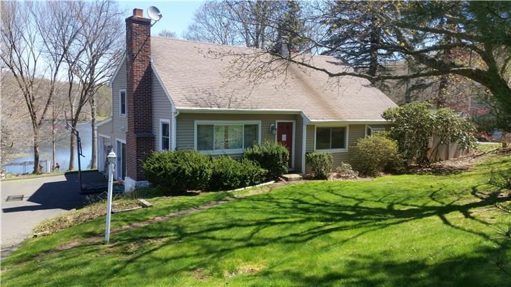 11 Saddle Rock Road Danbury, CT 06811 - Photo 1 of 1 a front view of a house with a yard