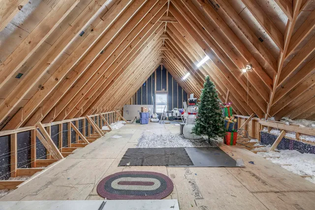 a view of a house with a yard and a garden