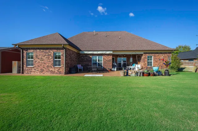 a patio with table and chairs