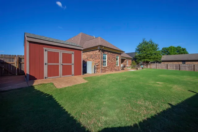 a view of a backyard with a garden