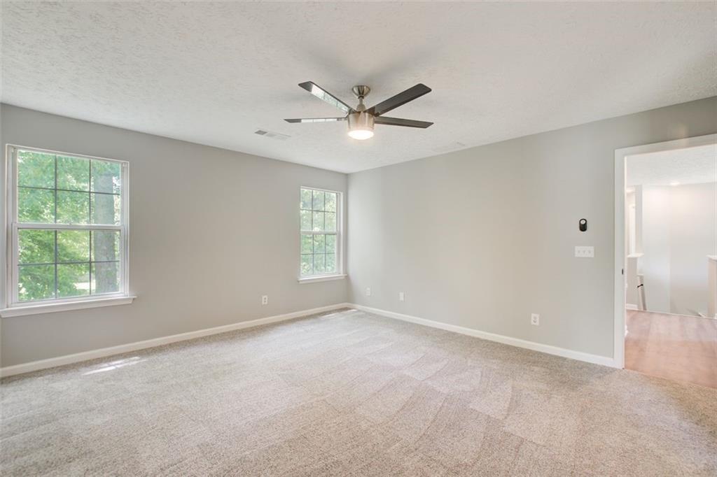 4110 Ridgebrook Bend Cumming, GA 30028 - Photo 33 of 49 a view of an empty room with a window