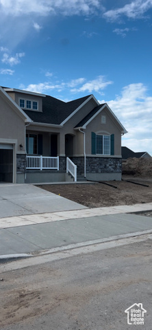 2004 East Burger Street Lake Point, UT 84074 - Photo 1 of 1 View of front facade featuring covered porch and a garage