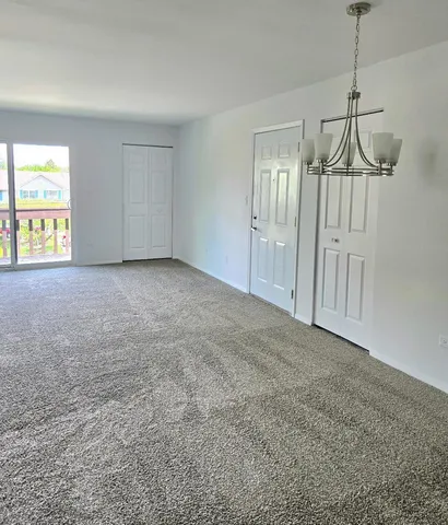 a view of empty room with windows