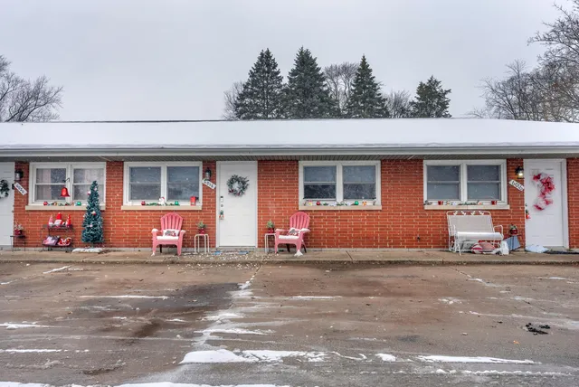 a front view of a house with a garage