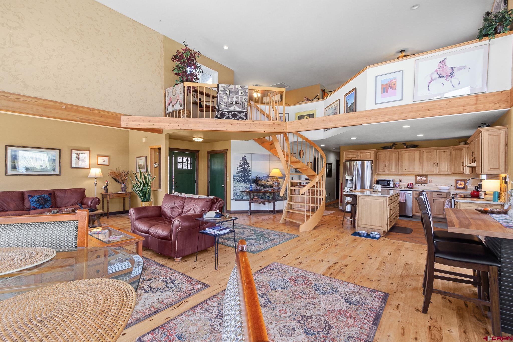 13720 6000th Road Montrose, CO 81403 - Photo 11 of 36 a living room with fireplace furniture and a large window