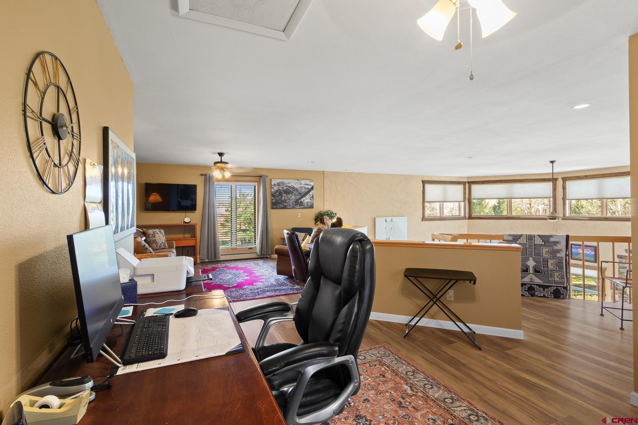 13720 6000th Road Montrose, CO 81403 - Photo 18 of 36 a view of a workspace with furniture and wooden floor