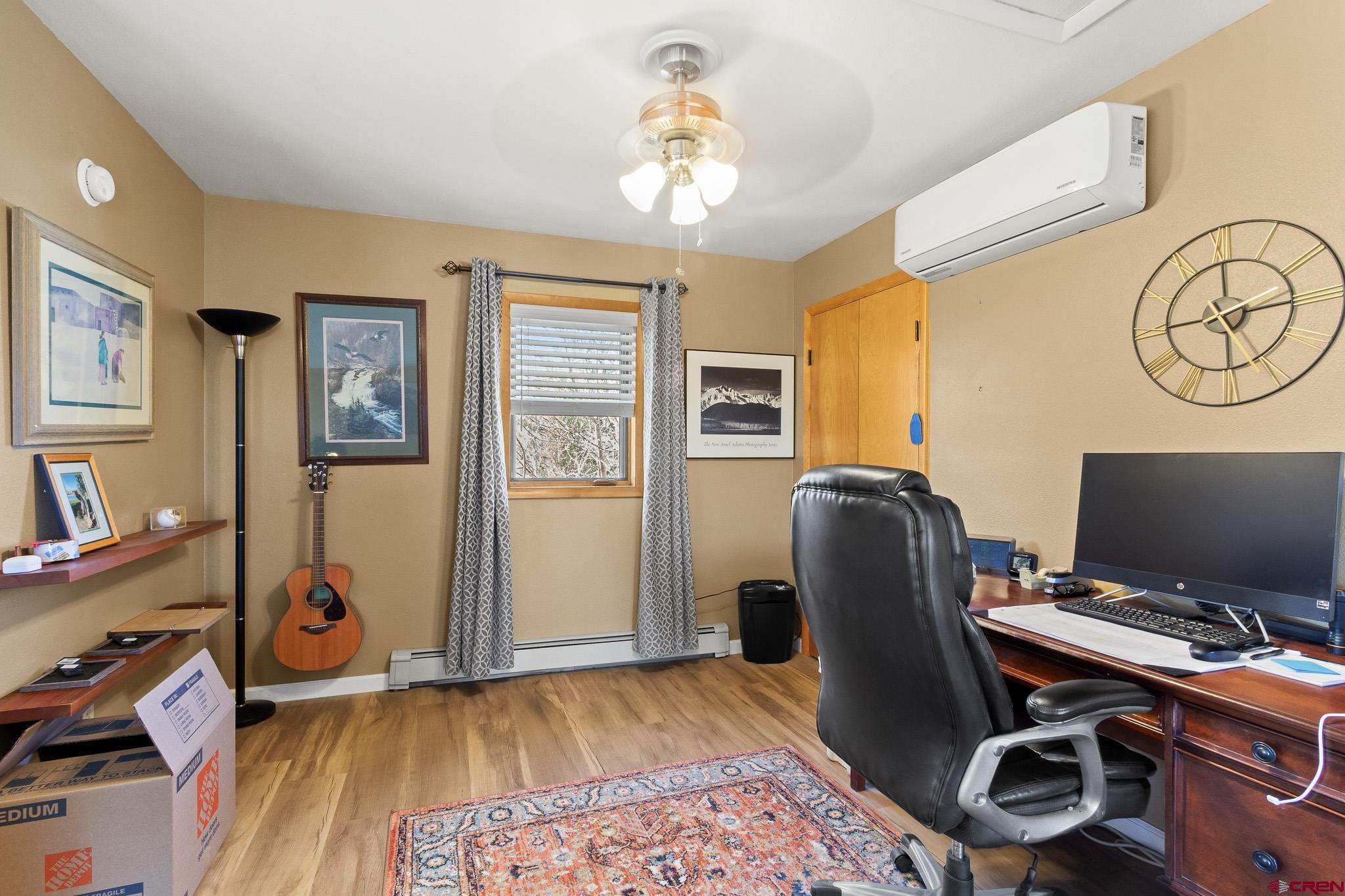 13720 6000th Road Montrose, CO 81403 - Photo 21 of 36 a view of a workspace with furniture and a window