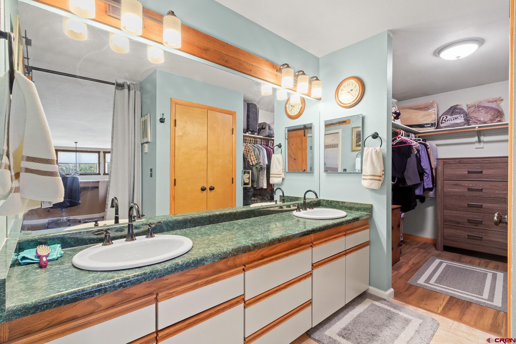 13720 6000th Road Montrose, CO 81403 - Photo 23 of 36 a bathroom with a sink and a mirror