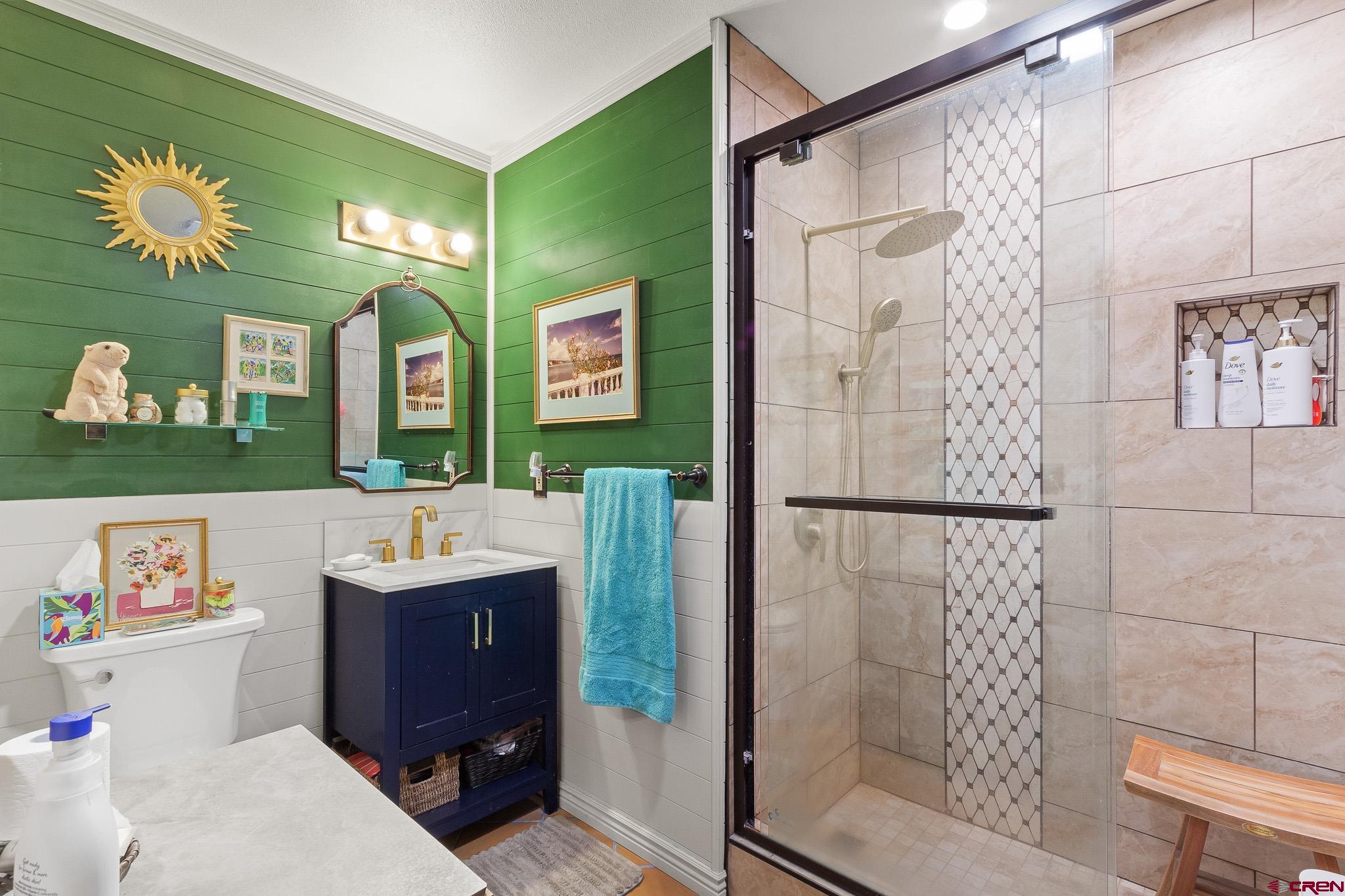 13720 6000th Road Montrose, CO 81403 - Photo 24 of 36 a bathroom with a sink a toilet and a shower
