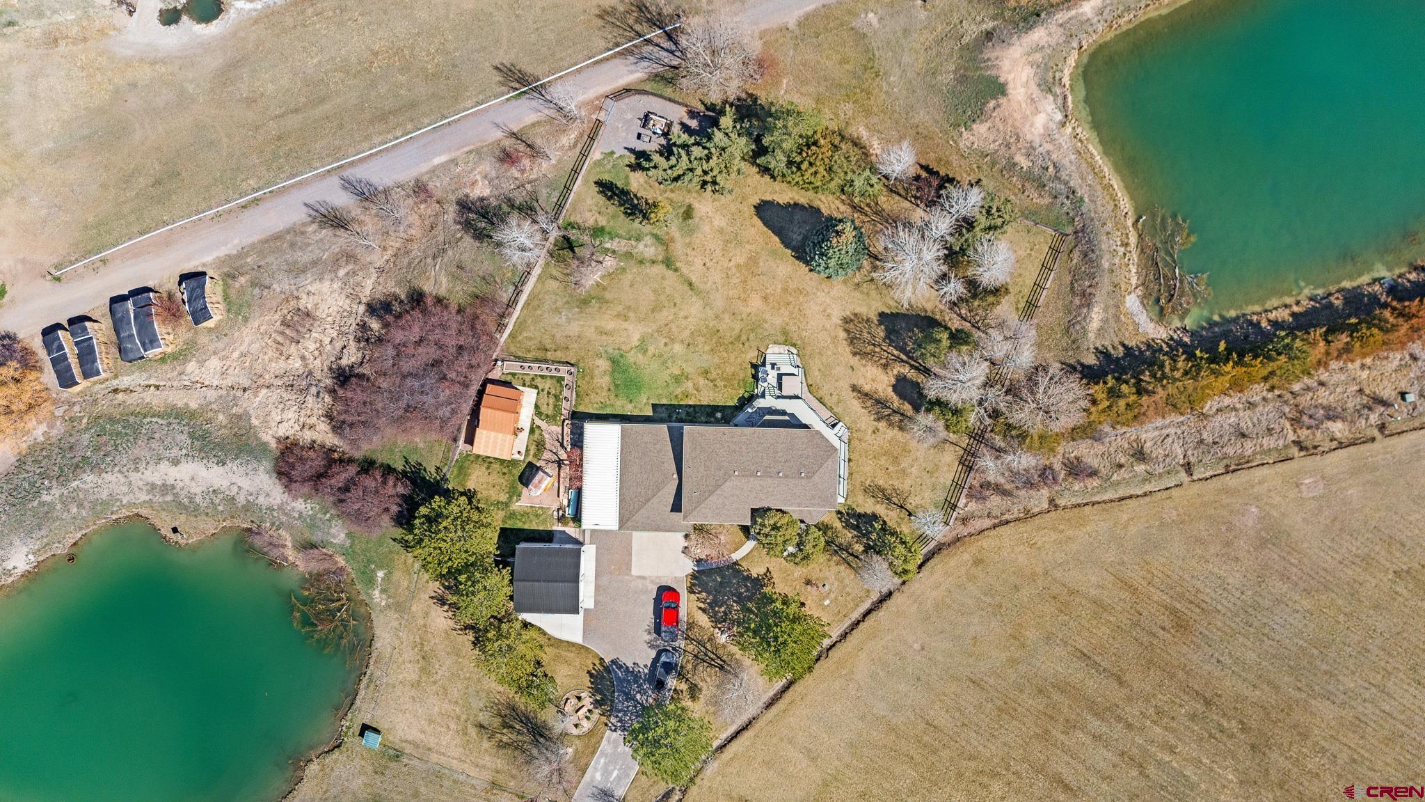 13720 6000th Road Montrose, CO 81403 - Photo 3 of 36 a aerial view of a house with a yard and garden