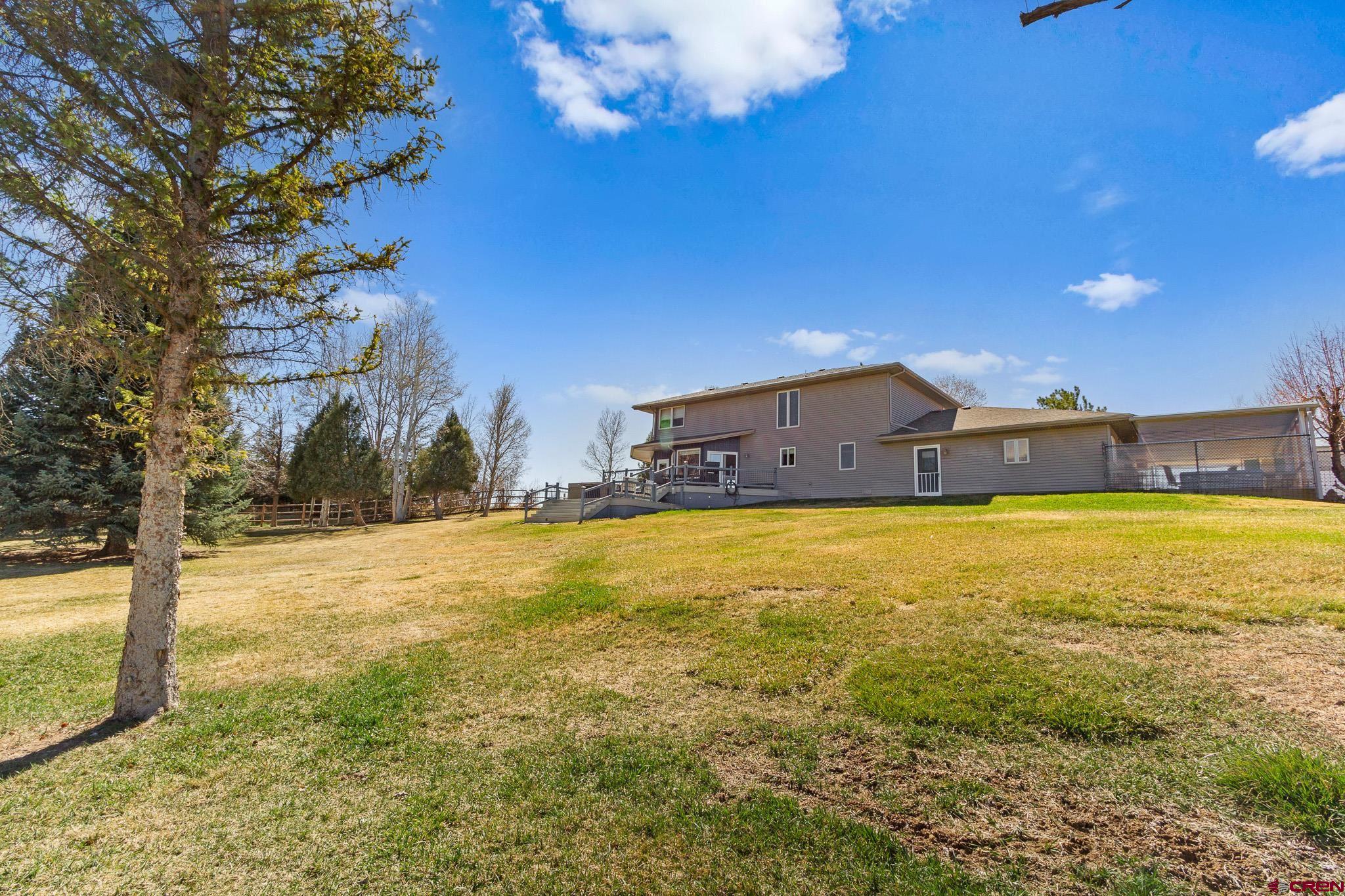 13720 6000th Road Montrose, CO 81403 - Photo 32 of 36 a view of an empty room with a swimming pool