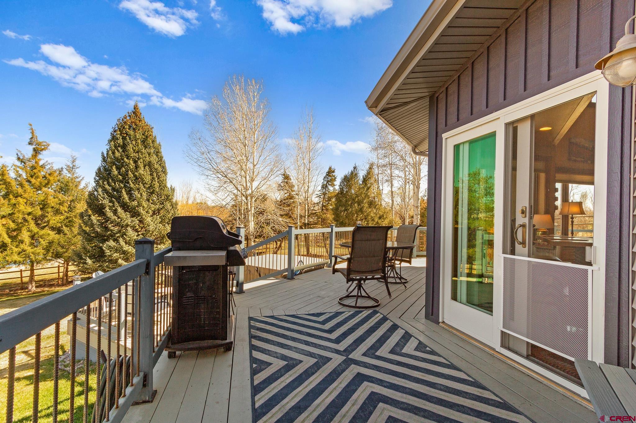 13720 6000th Road Montrose, CO 81403 - Photo 34 of 36 a view of balcony with wooden floor and outdoor seating