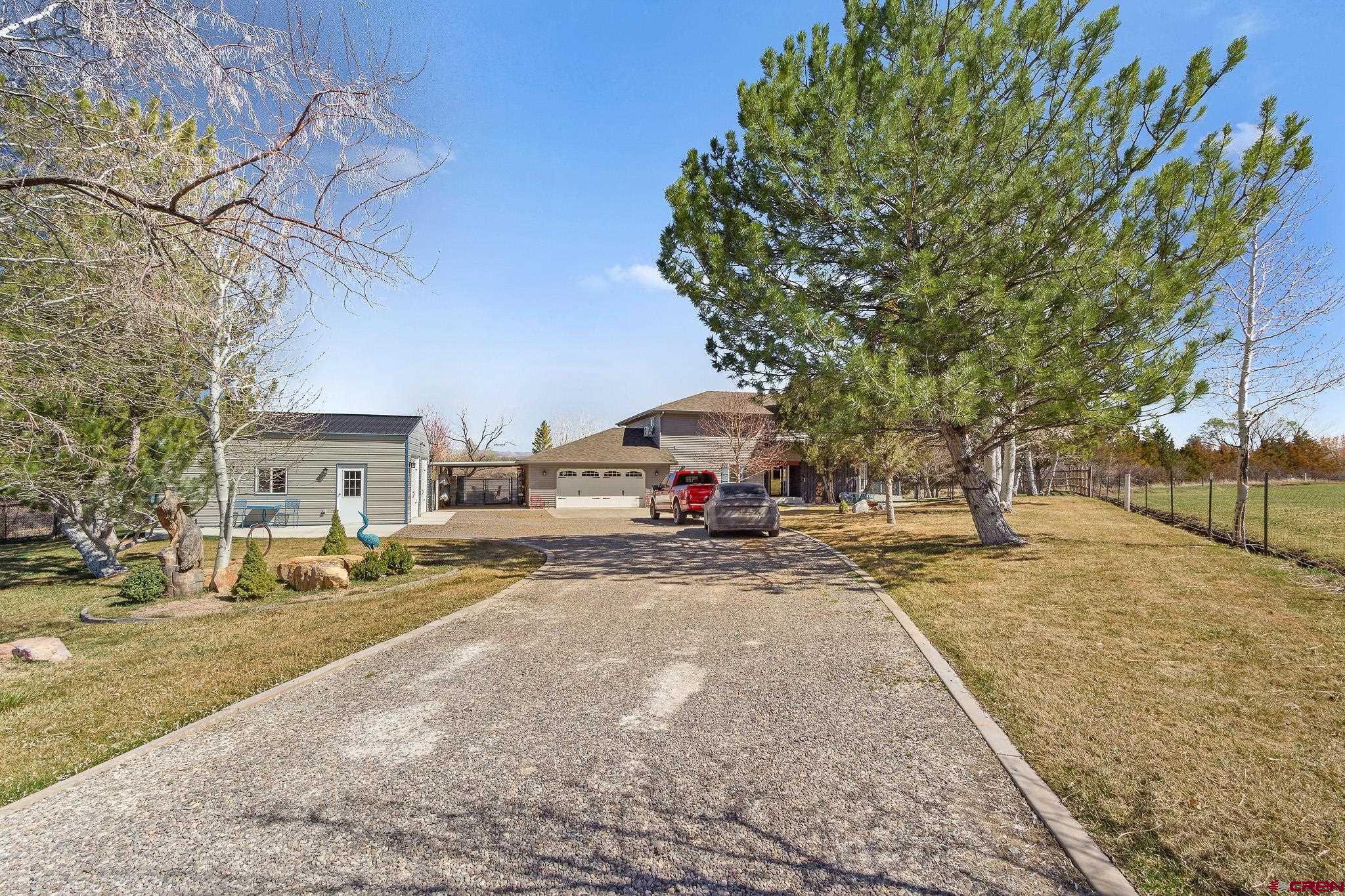 13720 6000th Road Montrose, CO 81403 - Photo 4 of 36 a view of a street with a building in the background