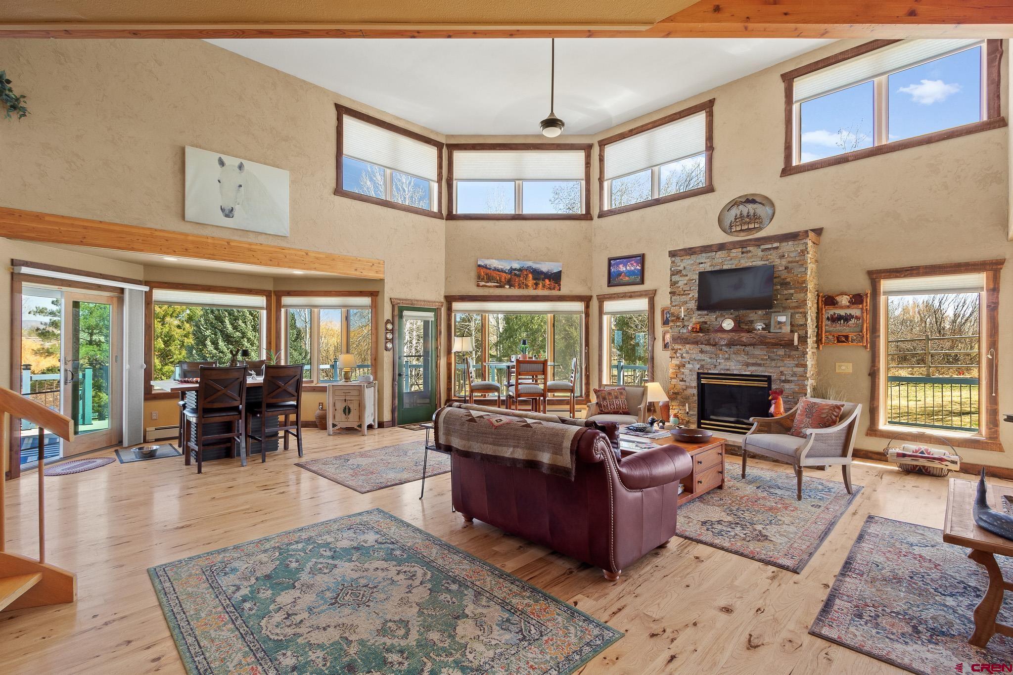 13720 6000th Road Montrose, CO 81403 - Photo 9 of 36 a living room with furniture large window and fireplace