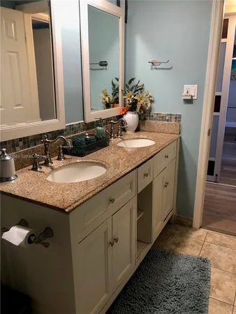 a kitchen with stainless steel appliances granite countertop a sink and a stove