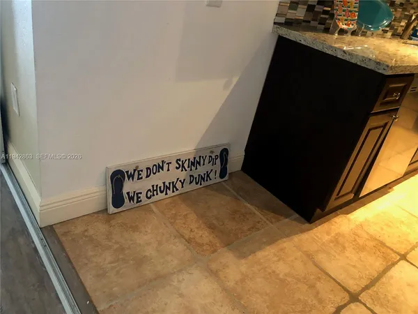 a view of a backyard with kitchen