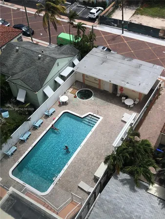 a view of parking garage with cars