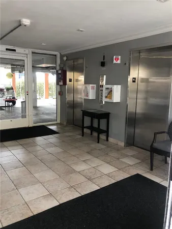 a room with gym equipment and a large window