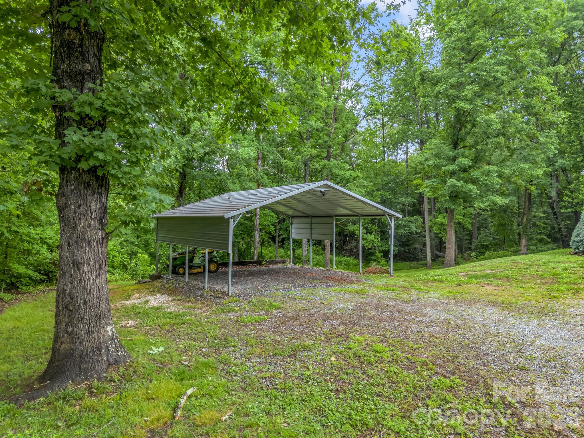 1449 Toney Road Bostic, NC 28018 - Photo 8 of 43 a backyard of a house with table and chairs