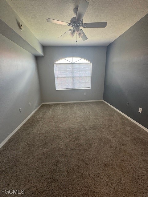 15625 Ocean Walk Circle, Unit 309 Fort Myers, FL 33908 - Photo 11 of 16 en empty room with windows and chandelier fan