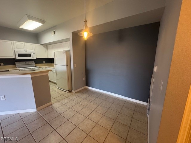 15625 Ocean Walk Circle, Unit 309 Fort Myers, FL 33908 - Photo 2 of 16 a kitchen with stainless steel appliances a refrigerator and a stove top oven