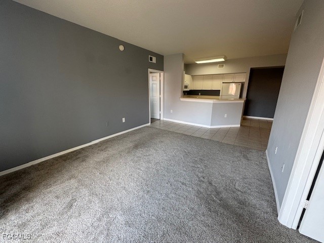 15625 Ocean Walk Circle, Unit 309 Fort Myers, FL 33908 - Photo 6 of 16 a view of a kitchen with a sink and a refrigerator