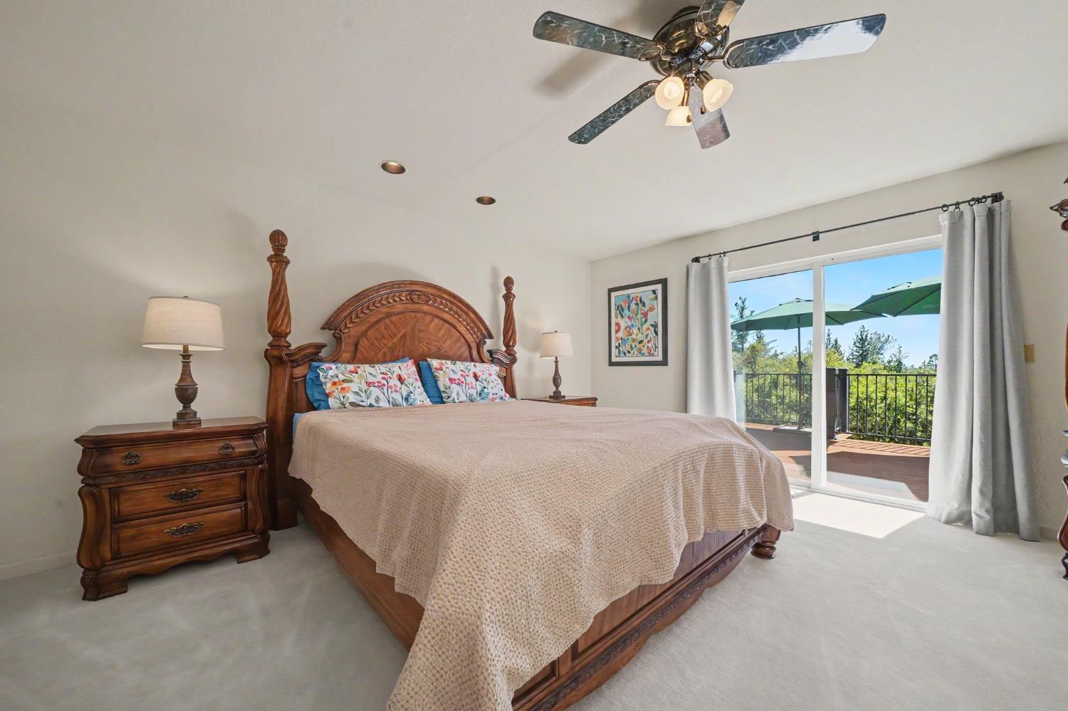 18299 West Clinton Road Jackson, CA 95642 - Photo 39 of 56 a spacious bedroom with a bed and a large window