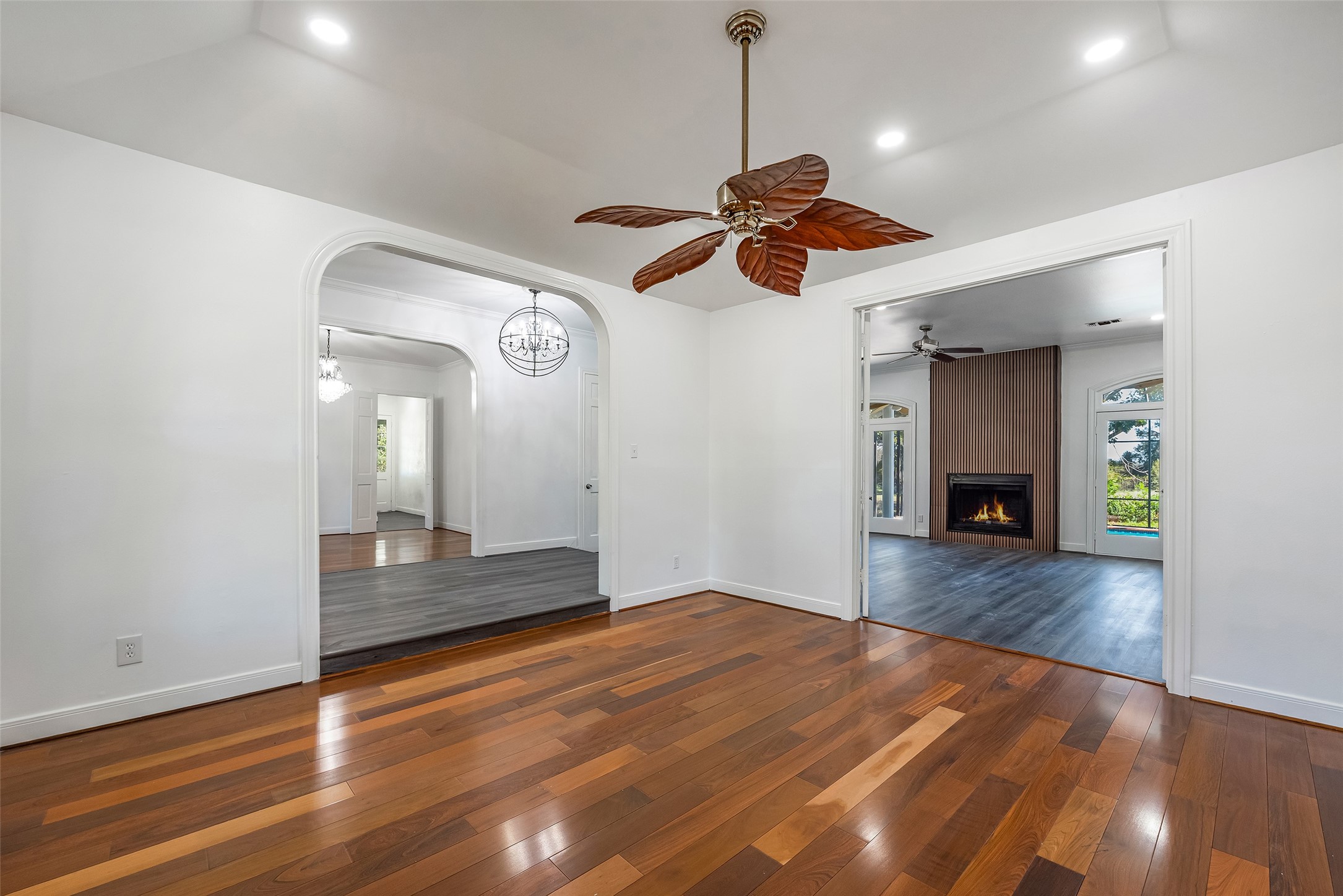 4610 Lea Lane Fulshear, TX 77406 - Photo 11 of 50 a view of an empty room with window and wooden floor