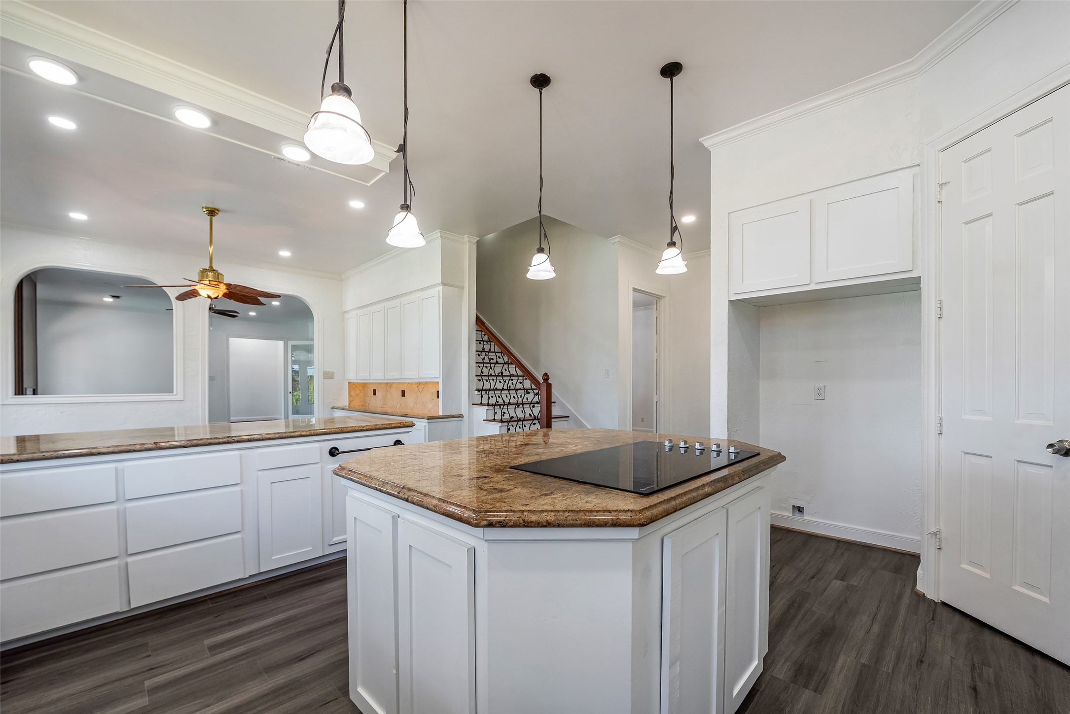 4610 Lea Lane Fulshear, TX 77406 - Photo 21 of 50 a kitchen with a sink a counter space and wooden floor