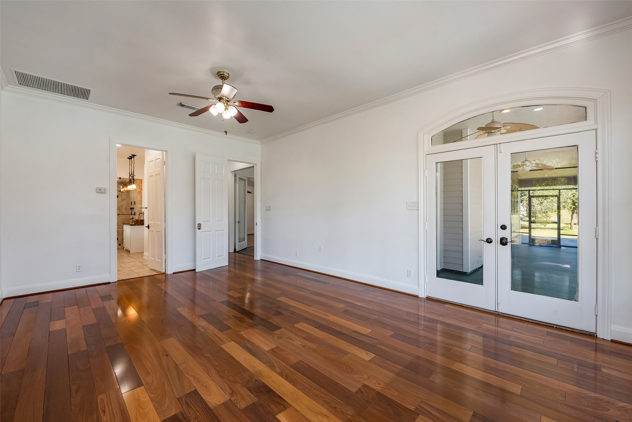 4610 Lea Lane Fulshear, TX 77406 - Photo 28 of 50 a view of empty room with wooden floor and fan