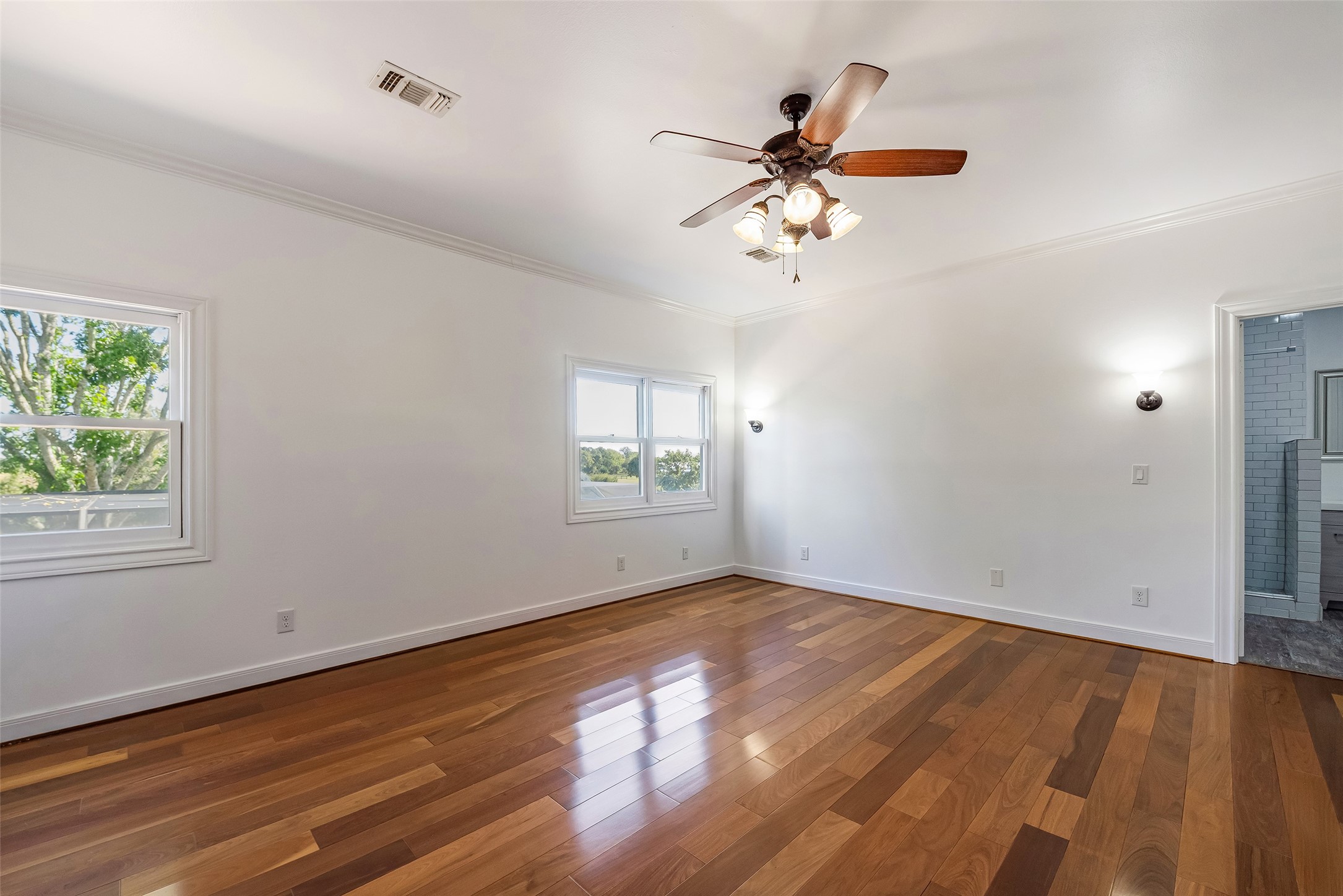 4610 Lea Lane Fulshear, TX 77406 - Photo 37 of 50 a view of empty room with wooden floor and fan