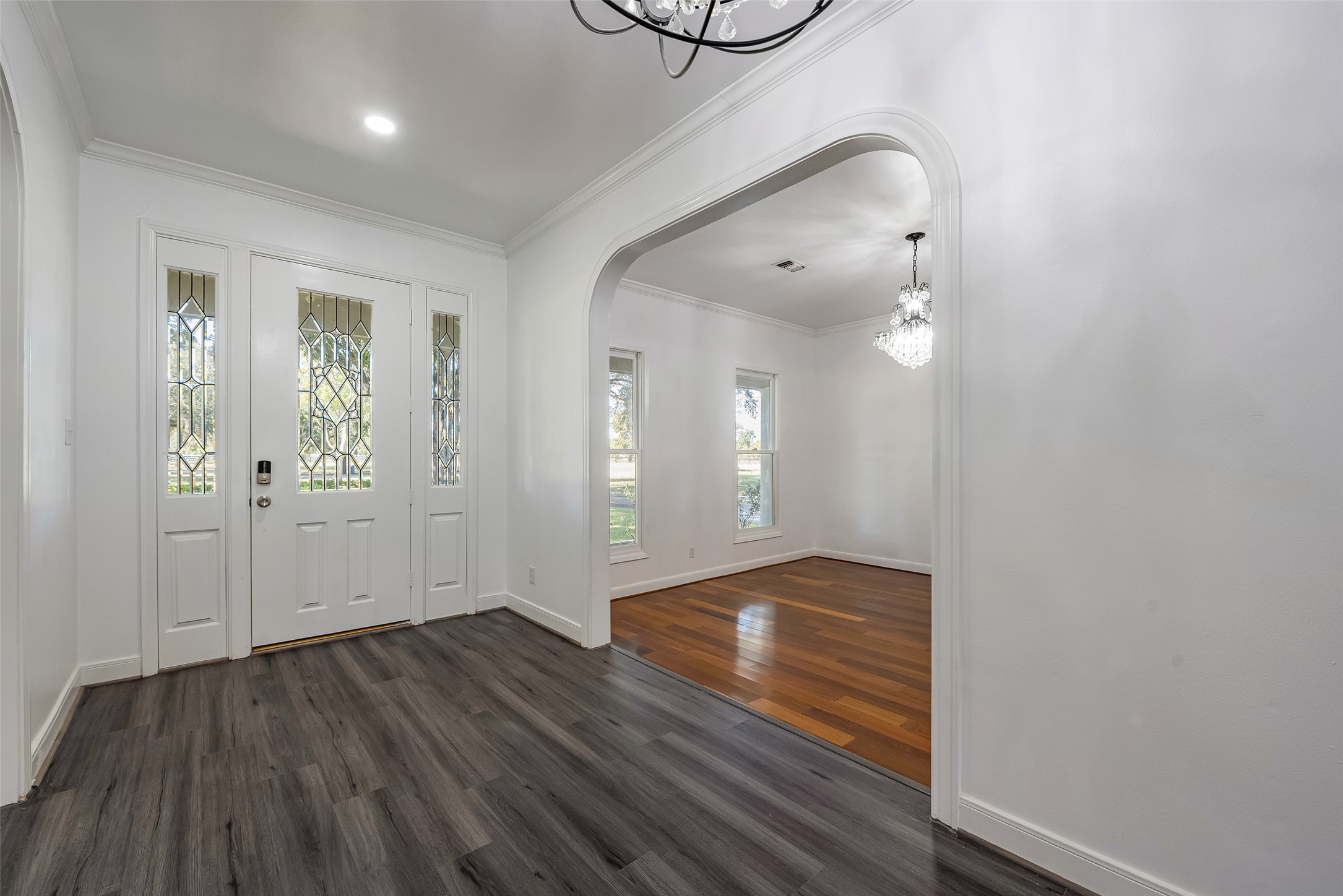 4610 Lea Lane Fulshear, TX 77406 - Photo 4 of 50 a view of an empty room with wooden floor and a window