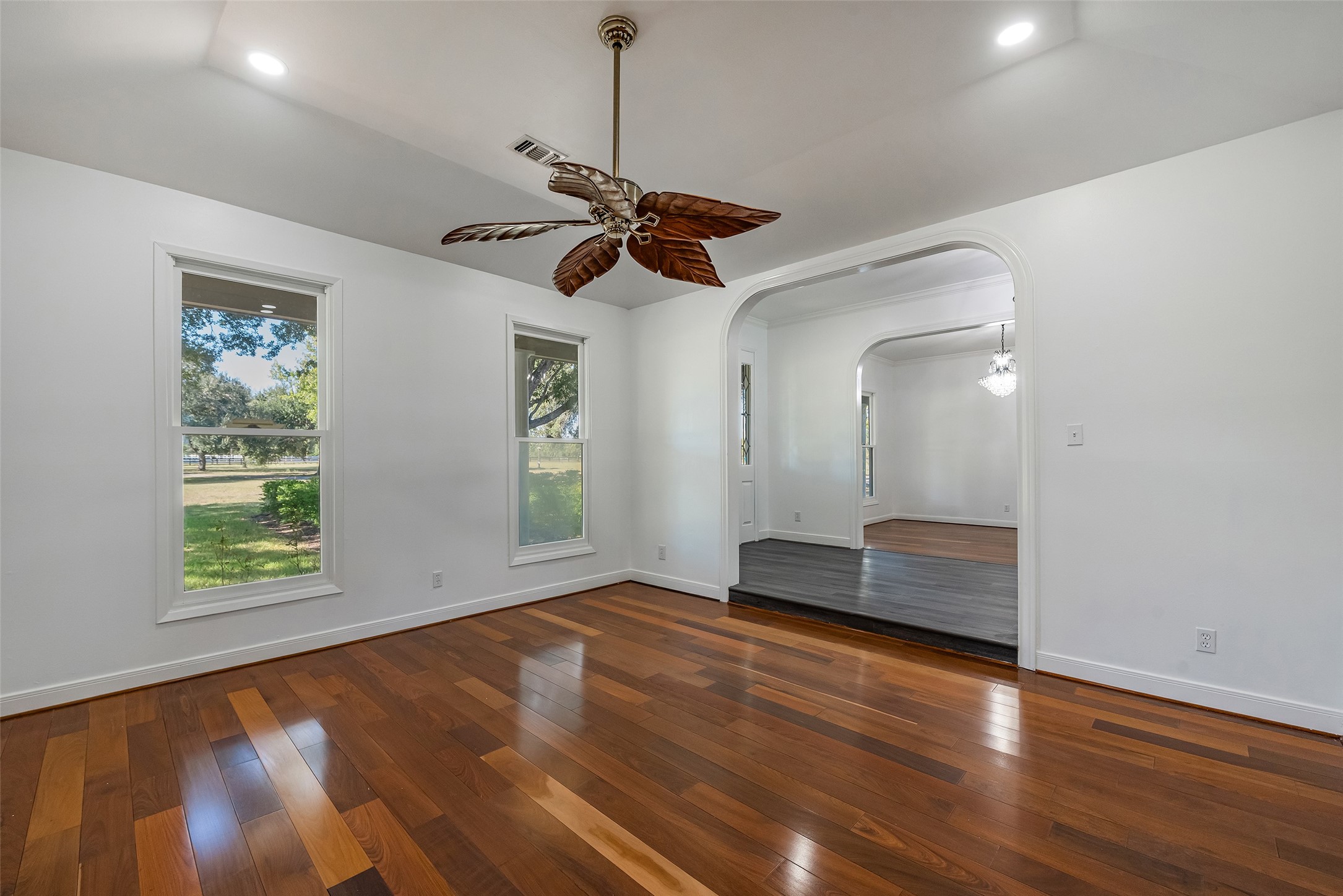 4610 Lea Lane Fulshear, TX 77406 - Photo 10 of 50 a view of an empty room with window and wooden floor