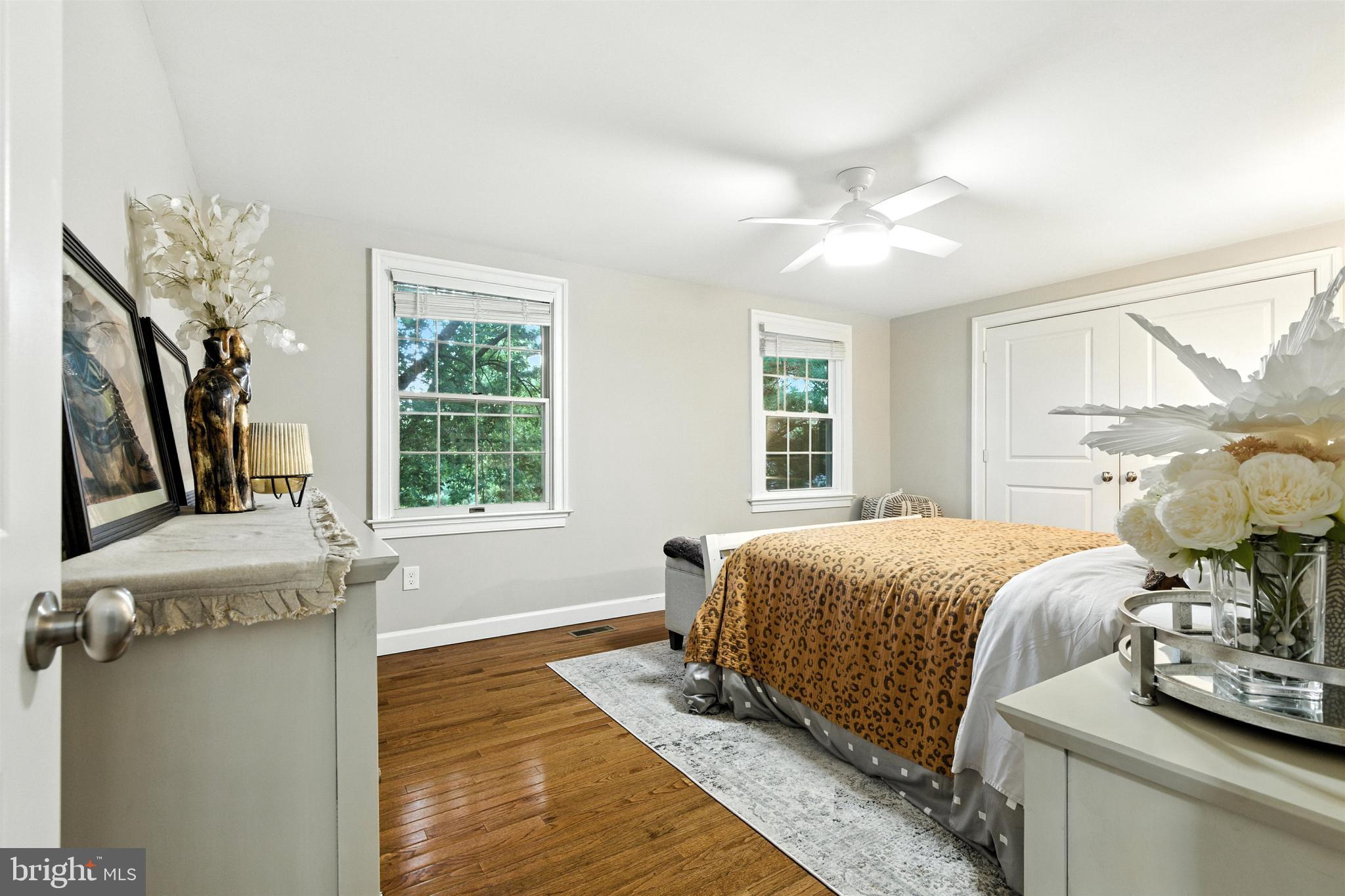 21804 Goshen School Road Gaithersburg, MD 20882 - Photo 12 of 37 a bedroom with a bed and wooden floor