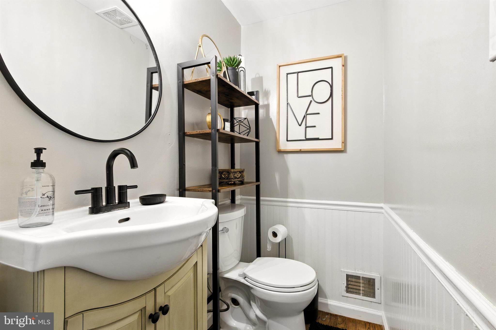 21804 Goshen School Road Gaithersburg, MD 20882 - Photo 13 of 37 a bathroom with a sink mirror and toilet