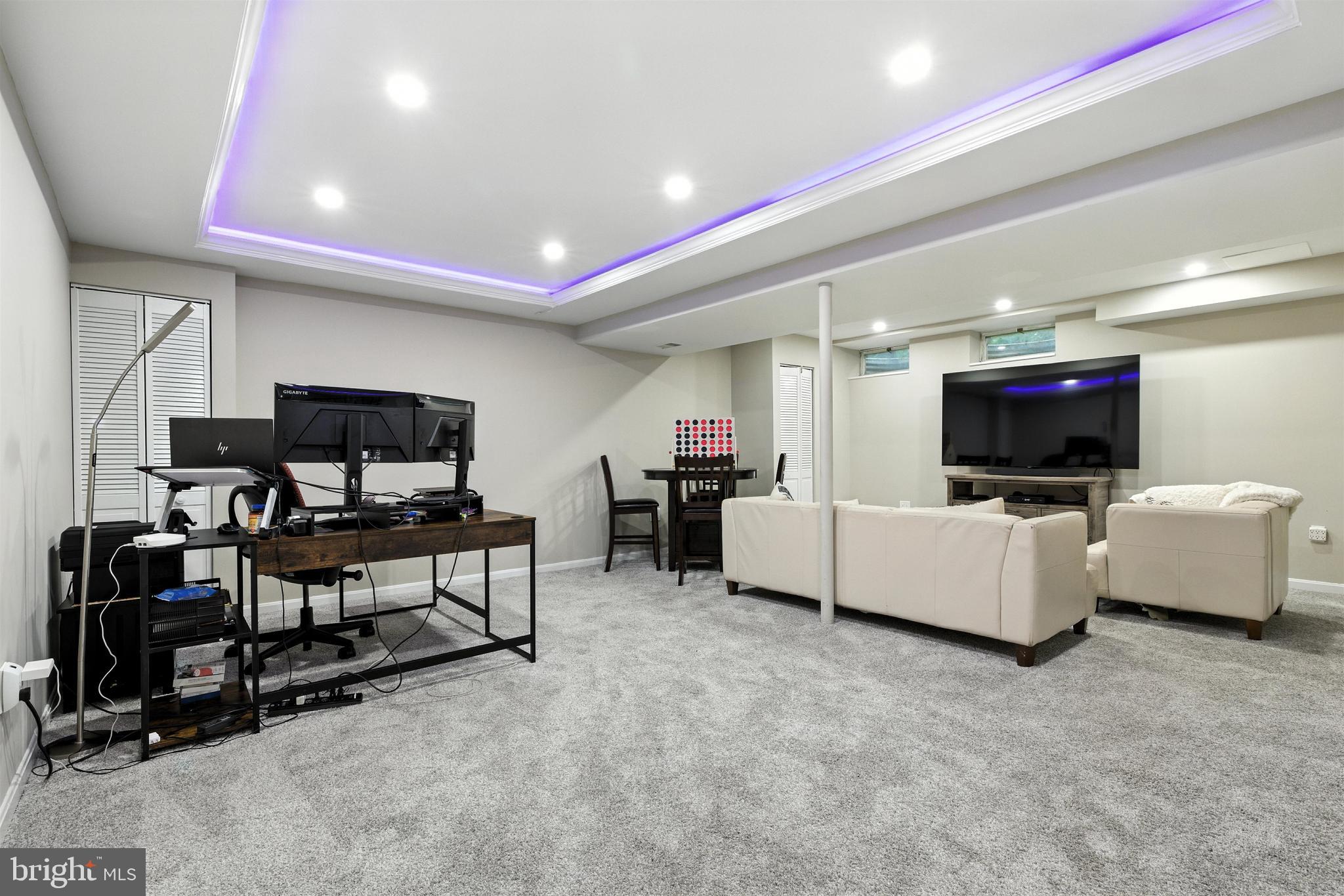 21804 Goshen School Road Gaithersburg, MD 20882 - Photo 15 of 37 a living room with furniture and a flat screen tv